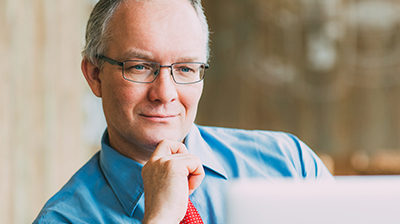 A businessman looking at a laptop