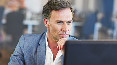 A businessman working on his computer